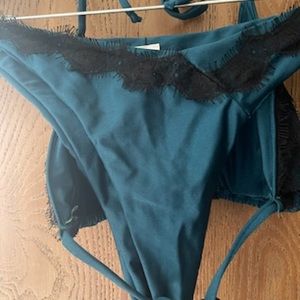 Via positano turquoise with black lace trim. Bikini, never worn. Made in Italy